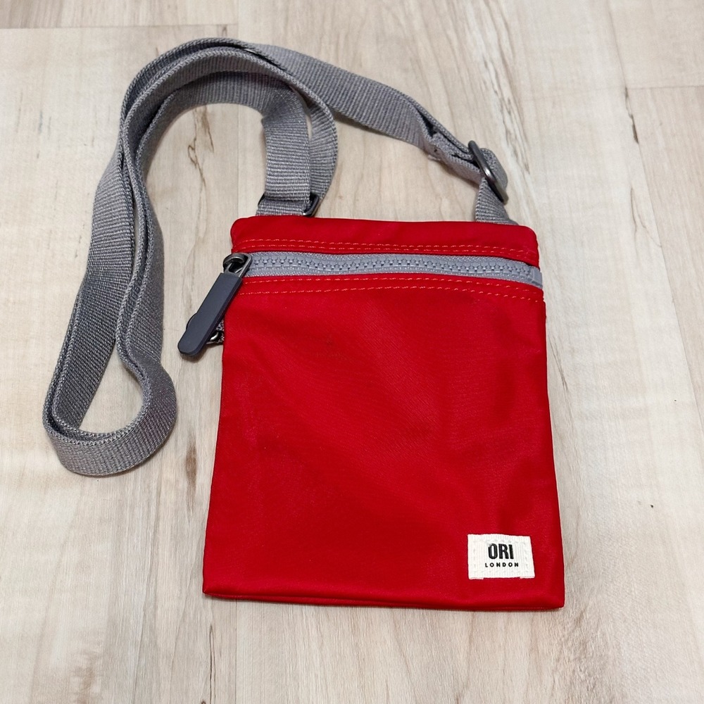 ORI London Chelsea Pocket Sling Bag in cranberry recycled nylon